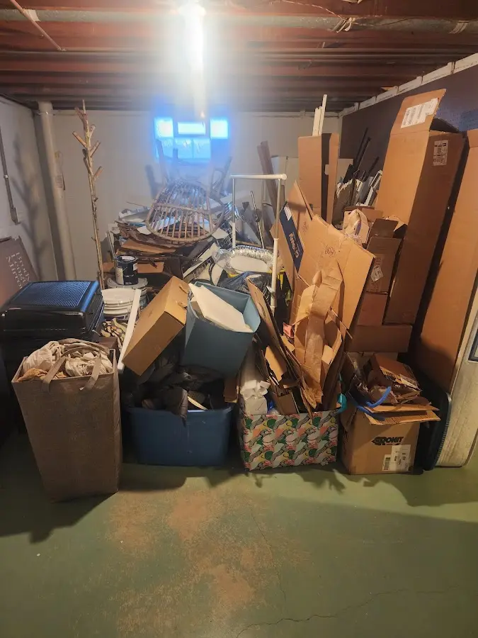 Roll-off dumpster container at job site for 15 Yard Dumpster Rental in Midvale